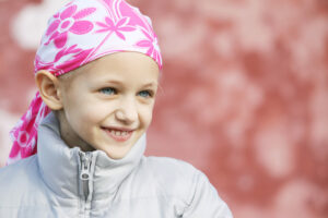 child with hair loss due to chemotherapy treatment