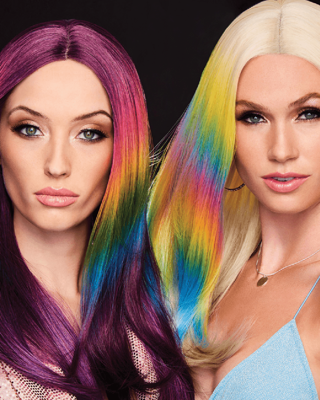 Two women side by side, wearing colorful rainbow wigs from HairDo. The wigs feature vibrant, multi-colored strands in fantasy shades, creating a striking and playful appearance.