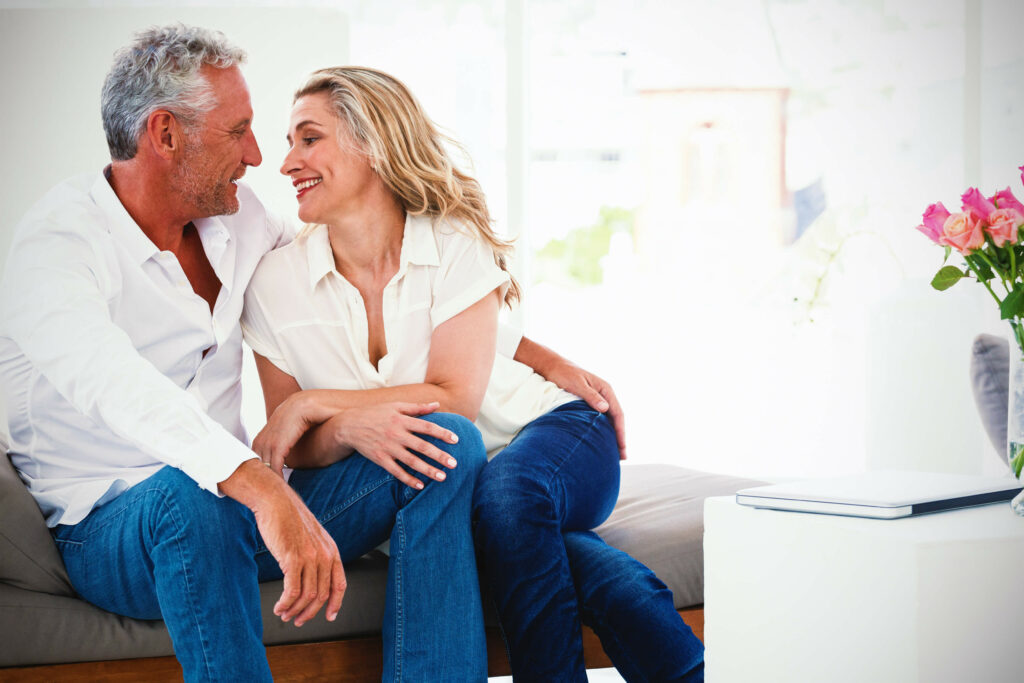 A couple share a romantic moment, confident about their hair loss solutions