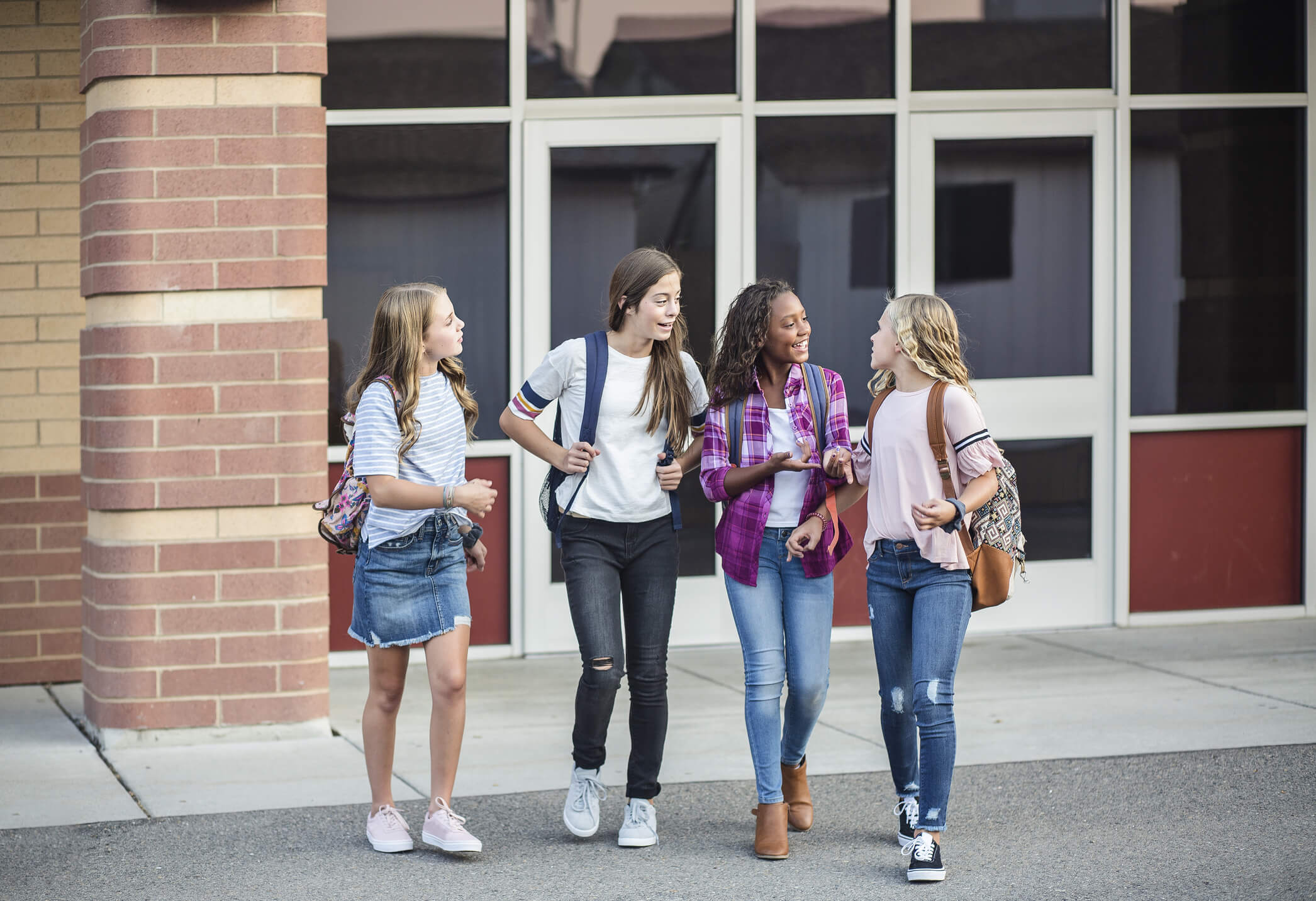 Four girls going back to school, confident wig wearing